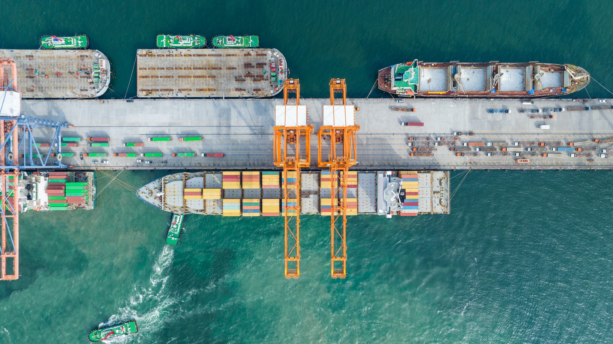 cargo-container-ship-load-container-box-to-cargo-ship-at-shipyard-bridge-of-container-sea.jpg